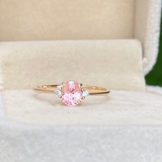 This elegant sapphire Ring featuring a 0.85ct Unheated & Untreated Natural Peach champagne Sapphire with two natural white diamonds Set in 14K solid Rose Gold, handcrafted in Sri Lanka.Main Stone : Natural Peach SapphireShape: OvalWeight: 0.85caratColor: Champagne PeachTreatment: NoneClarity : VSOrigin: Sri Lanka (Ceylon)Accent Stones: Natural White Diamonds (1.8mm)Metal: 14K Rose Gold (Available in Yellow Gold & White Gold, 18k Gold, Please get in touch with me ) Peach Saffire Ring, Elegant Peach Gemstone Ring, Peach Sapphire Halo Engagement Ring, Peach Champagne Sapphire, Champagne Sapphire, Peach Sapphire Rings, Peach Sapphire, Pink Sapphire Ring, Sapphire Diamond Ring