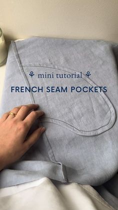 a person is sewing on a french seam pocket