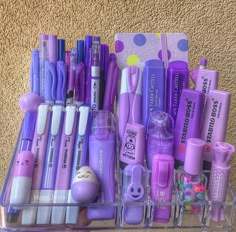 a clear container filled with lots of different types of pens