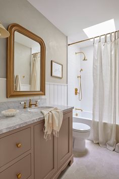 a bathroom with a sink, toilet and shower