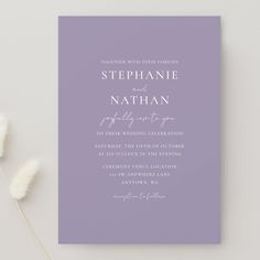 a purple wedding card with the words stephanie and nathan written in cursive font