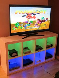 a flat screen tv sitting on top of a entertainment center