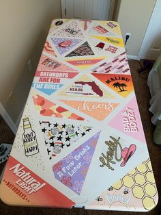 a table covered in lots of different types of stickers and decals on it