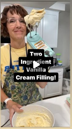 a woman in an apron holding a bowl of cream filled dough with the words two ingredient vanilla cream filling