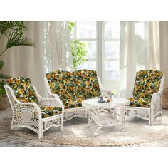 a living room with white wicker furniture and sunflowers on the couches