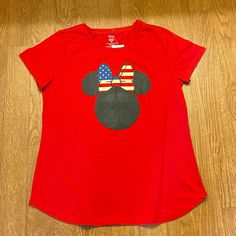 Disney Minnie Mouse Celebrate Together Red Short Sleeve T-Shirt. Minnie Mouse Crew Neck Top For Disney Events, Minnie Mouse Cotton T-shirt, Cotton Minnie Mouse T-shirt With Short Sleeves, Cotton Minnie Mouse Short Sleeve T-shirt, Fun Red Minnie Mouse T-shirt, Red Minnie Mouse Tops For Disney Fan Events, Red Minnie Mouse Top For Disney Fan Events, Red Minnie Mouse Short Sleeve Top, Red Disney Short Sleeve Tops