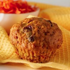 a muffin sitting on top of a yellow napkin