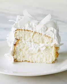 a piece of cake with white frosting on a plate