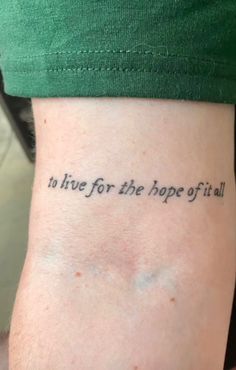 a person with a tattoo that says to live for the hope of all