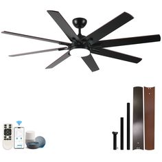 a black ceiling fan with remote controls and other items around it on a white background