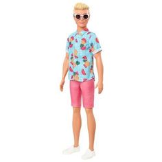 a doll wearing pink shorts and a blue shirt with fruit on it's chest