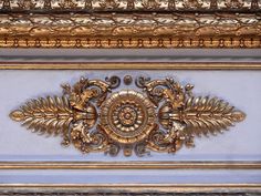 an ornate gold and blue wall decoration