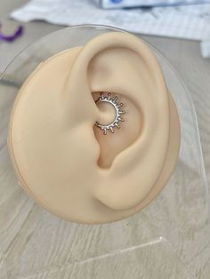 a fake ear with a ring on top of it