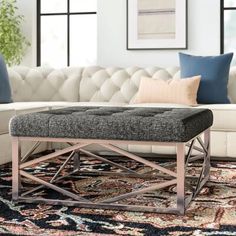 a living room scene with focus on the ottoman