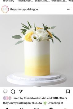 a white and yellow wedding cake with flowers on top is featured in the instagram