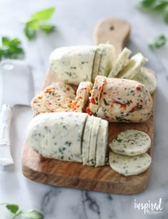 cheese and crackers on a wooden cutting board