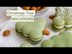 christmas tree macaroons with almonds in the background and green frosting on top