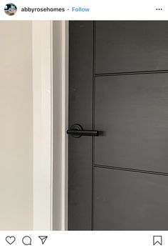 the door is open and there are black handles on it