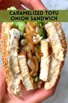 someone is holding up a sandwich with onions and mushrooms on it in front of the words caramelized tofu onion sandwich