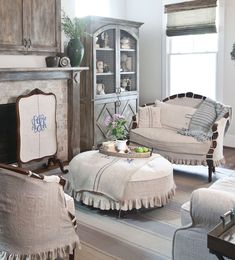 a living room filled with furniture and a fire place