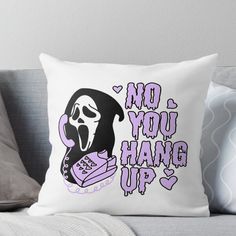 a pillow that says no you hang up with a ghost holding a controller in it