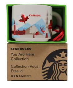 starbucks mug with red ribbon in green box