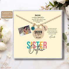 a necklace with two pictures on it and the words sister in different languages are shown next to flowers