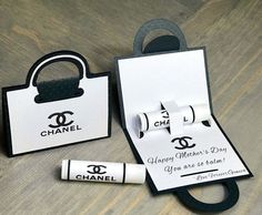 a chanel bag and two rolls of toilet paper