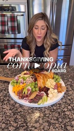 a woman sitting at a table with a plate of food in front of her on thanksgiving