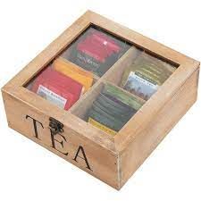 a wooden box filled with different types of tea