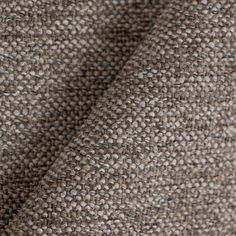 close up view of the texture of a tweed fabric