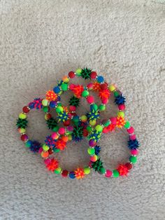 "Bring back the 70's with this Rainbow Rubber Spike Bracelet surrounded by an array of Fluorescent beads and Swarovski spacers!  You will receive one bracelet at random.    It stretches to fits up to a 7.0\" wrist.  It can be custom made to fit smaller and larger sized wrists.  Comes wrapped in a gift giving bag with tie. In stock items ship within 2-3 business days.  Custom orders can take up to 10 days. All of my items are carefully packaged and sent in a box or bubble mail envelope. Shipping Rainbowcore Fashion, Pony Bead Jewelry, Kandi Inspo, Mail Envelope, Spike Bracelet, Kandi Ideas, Bracelet Inspiration, Country Style Outfits, Kandi Bracelets