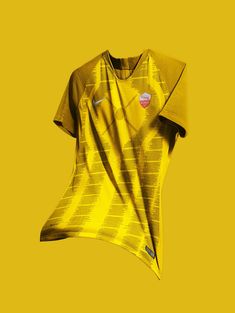 a yellow t - shirt with an abstract design on the front and back, against a yellow background