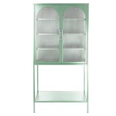 a green metal cabinet with two doors