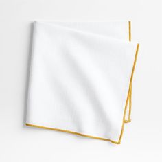 two white and yellow napkins on top of each other