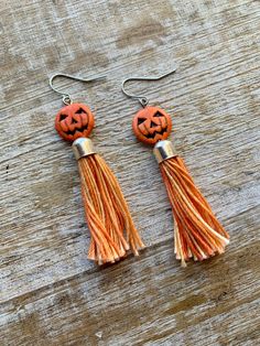 Handmade with howlite pumpkin beads and orange threaded tassels 🎃 Earrings measure 2 7/8 inches long. These can be made into infinity wires for people with tunnel gauges. Message me if this is what you need! Adjustable Orange Tassel Earrings, Orange Tassel Dangle Earrings, Orange Tassel Earrings, Orange Beaded Tassel Earrings As Gift, Orange Tassel Drop Earrings As Gift, Adjustable Dangle Tassel Earrings As Gift, Orange Tassel Drop Earrings For Gift, Orange Tassel Drop Earrings, Orange Tassel Earrings Gift