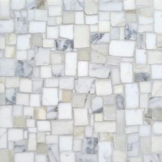 a white and grey mosaic tile wall