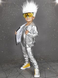 a man in silver and yellow is holding a white jacket over his shoulder while standing on a tiled floor