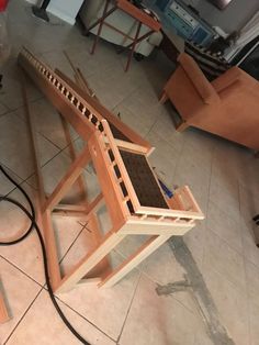 a wooden structure sitting on top of a tile floor