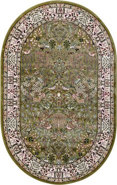 a green rug with an ornate design on the center and bottom, surrounded by flowers