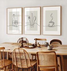 two framed pictures on the wall above a dining room table with chairs and place settings