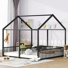 a child's room with a black and white house bed