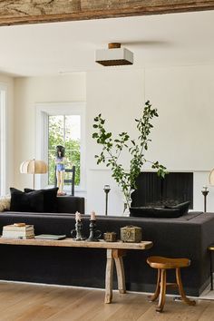 a living room filled with furniture and a fire place