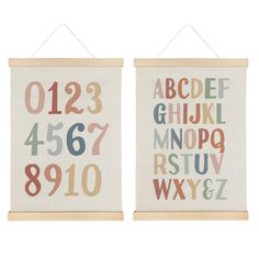 two wall hangings with numbers and letters on them, one has a wooden frame