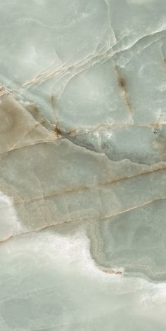 an aerial view of the top of a mountain with snow on it's sides