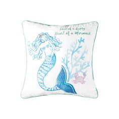 a white pillow with a blue mermaid design on the front and bottom, along with words written in cursive writing