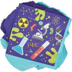 purple and blue napkins with science themed designs on the bottom one is folded in half