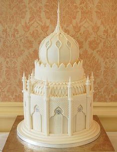 a large white cake sitting on top of a table