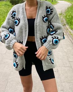 Please contact for different color! Standard size is large size mold. Color : Gray ! - Delivery in 1-3 days - %100 Naturel  - %100 Handmade - Worldwide Shipping! - Hand Wash  - Chunky - Cropped  - For Women Evil eye cardigan is the new cardigan I designed for women! For now, I knit only in gray color. I can also add different colors to the pastry upon request. The eye-shaped cardigan, which is completely hand-knitted, will keep you as warm as a coat in cold winter months. It will be very easy fo Gray Knitted Acrylic Outerwear, Oversized Knitted Gray Cardigan, Oversized Gray Knitted Cardigan, Trendy Knitted Gray Cardigan, Gray Open Front Trendy Cardigan, Trendy Gray Open Front Cardigan, Gray Oversized Open Front Cardigan, Casual Gray One-size Cardigan, Gray Knit Open Front Sweater