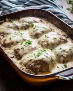 a casserole dish with meatballs and gravy